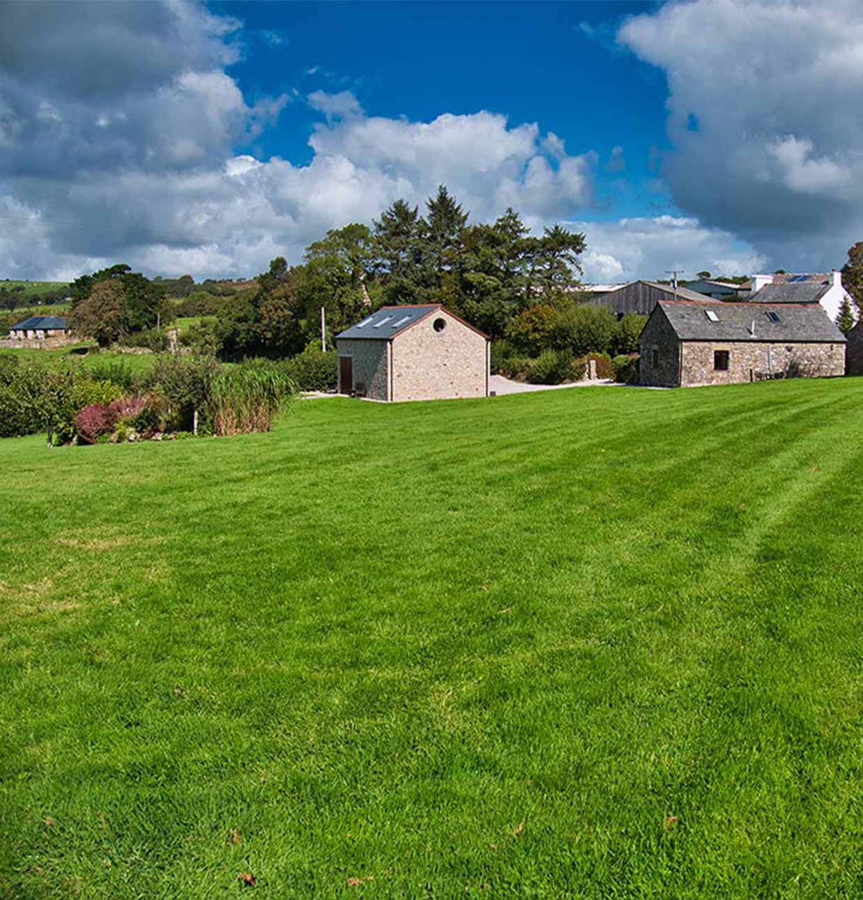 A photo from the green lawn at Tremaddock Farm Holiday Cottages