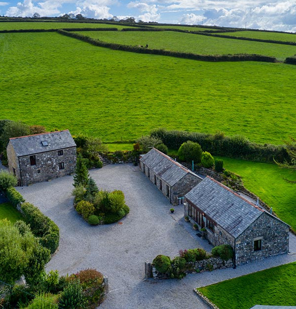 An aerial photo of Tremaddock Farm Holiday Cottages and their spacious parking area
